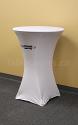 This 30 inch diameter round white fire resistant economy spandex stretch cocktail table cover displays a simple 1 colour black print on the front for economical yet stylish branding