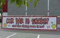 Shown is a 3 foot high x 12 foot wide scrim vinyl banner with reinforced hems all around and grommets every two feet