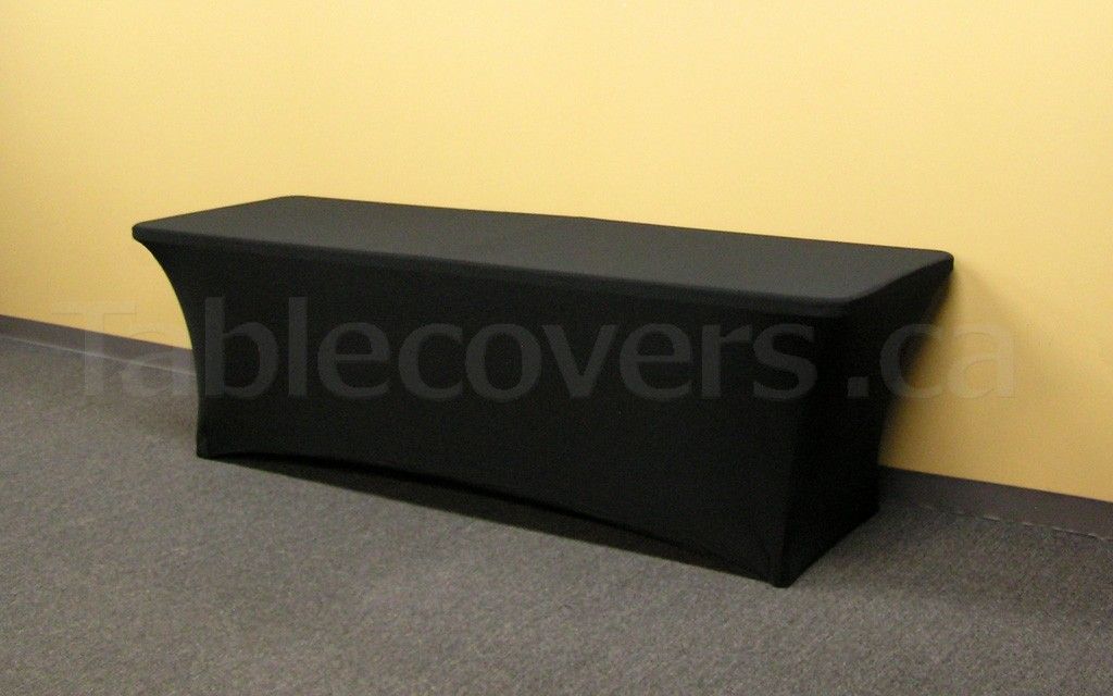 This plain unprinted 8' black flame retardant economy spandex stretch table cover is ideal for economical yet stylish table covering applications