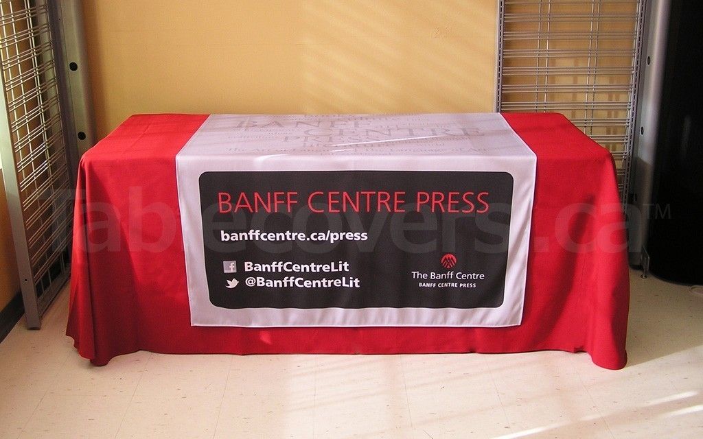 48 inch x 60 inch table runner for trade shows and display tables with your logos, colours and graphics custom dye sublimation printed over the entire table runner (shown on 6' Atomic Red plain unprinted economy table throw)