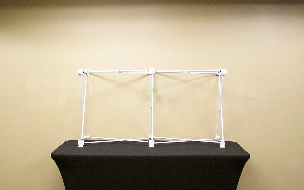 The Velocé Image 2x1 5 foot wide straight frame hardware includes a tubular metal scissor frame with velcro tabs on hubs and soft nylon carrying bag